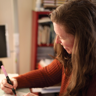 Photo of Woman Coloring in Stationery