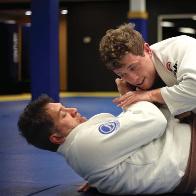 Candid Photo of Men Practice Sparring